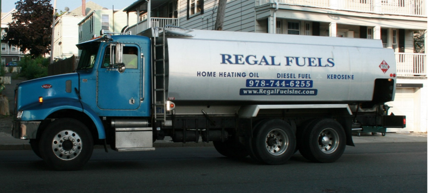 This figure shows two images of single-unit trucks with hazardous cargoes. The first carries home heating oil and the second carries welding supplies. 1 of 2.